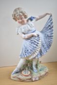 A 19th century German Bisque porcelain figure of a young girl dancing with tambourine, h40cm