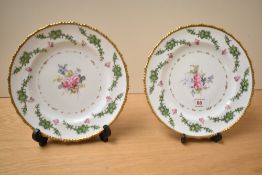 A pair of decorative Royal Crown Derby plates, having gilt rim with hand painted floral