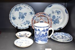 A Chinese export blue and white tankard or mug, decorated with chinoiserie scenes and dragon form