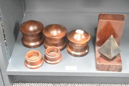 A set of 3 turned wood lidded trinket boxes, largest 9cm, sold together with a pair of bookends