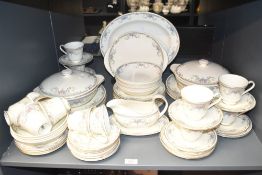 A Royal Doulton Juliet pattern fine bone china dinner service, decorated with floral patterns on a