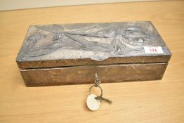 An Art Nouveau style rectangular pewter rectangular glove box, decorated with repousse dragon fly
