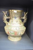 A 19th century Chinese bronze vessel of archaic design, having two handles and decorated with