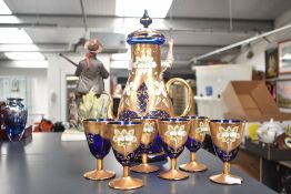 A vintage cut everylay glass tea service, hand decorated with gilding and floral patterns on a