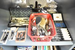 A large group of various silver plate cutlery, to include spoons , dressing mirror, candelabra and