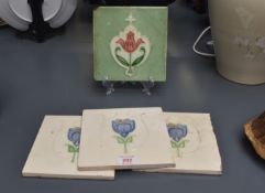 A early 20th century Henry Richards style tile, decorated with a pink poppy on a green glaze ground,