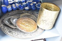 A group of brass wall plaques decorated with pub scenes and floral patterns, largest 63cm, sold
