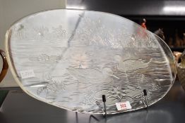 An attractive moulded glass oval platter, decorated with duck pond scene 42.5cm sold along with a