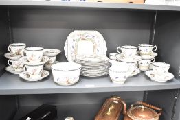 A Melba Rose pattern fine bone China part tea service decorated with tropical birds and foliage on a