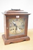 A mahogany 31 day chiming mantel clock having silvered chapter ring with Roman numerals, impressed