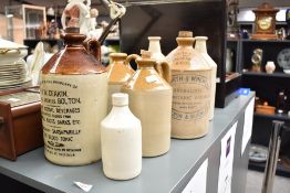 A J.W. Deakin stoneware flagon, having Isle emblem, dated 1938, h27.5cm, sold together with