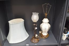 A patinated metal Art Nouveau style figural table lamp having frosted floral stylised globe, h46,