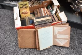 A box containing various books, to include A Treasury of Cat Stories, The Short Stories of Thomas