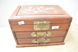 A vintage Chinese rosewood and brass jewellery box, having mother-of-pearl inlay to the lid and