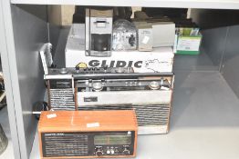 A 20th century Roberts RM30 table top radio, having teak wood surround, L28.5cm, sold together