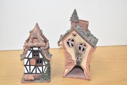 A ceramic house / light candle holder, signed to base, h21cm, sold together with another ceramic