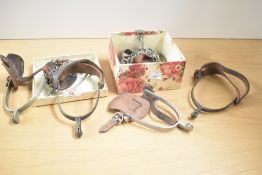 A pair of early 20th century spurs having white metal spur with leather strap, 9cm, sold together
