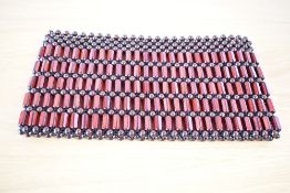 A 1970s style wooden beaded clutch bag/purse, featuring red and brown hexagonal carved beads