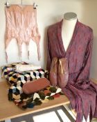 A collection of antique and vintage inner wear, along with an example of antique folk craft. A