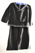 A custom made 1950s ladieswear two piece outfit, in thick black velvet, adorned with a floral