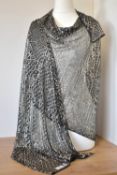 An Egyptian Assuit silver shawl, highly embellished, possibly antique. Assuit (also known as tulle-