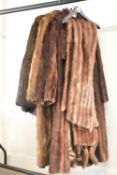 A collection of vintage fur items, comprising two long coats, one of which a belted Victor Segall, a