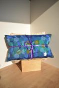 Two vintage scatter cushions, one hand-sewn oblong example showcasing hexagonal patchwork of