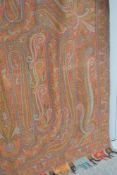 A 19th century Scottish wool shawl or blanket, in beautiful paisley weave, having a rich mix of