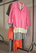 A capsule collection of eight 1980-90s ladies button-down summer wear, comprising three skirts,