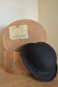 A vintage A.J. White Hatters bowler hat and carrying box, with local interest, made by Same Cooke of