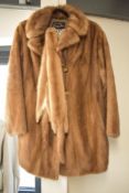 A vintage Baray Furs of Liverpool mid brown fur coat, having wide notch lapels, three brown/cream