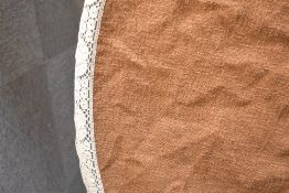 A 1950s Sturzenegger circlular tablecloth in latte brown boucle textured weave wool, with a cream