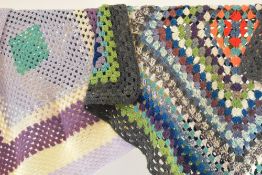Two vintage granny square blankets cool shades of multicolour stripes, the darker blanket