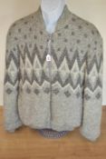A Lana bomber jacket in light grey, open-knit, fluffy Icelandic wool. Featuring ribbed collar and