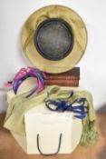 A collection of modern wedding accessories, comprising a wide Viyella hat in navy and neutral