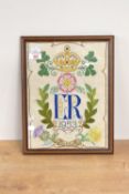 A framed embroidery commemorating Queen Elizabeth II 's coronation in 1953.