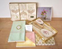 Four boxes containing vintage linens and home accessories, comprising a Northern Irish made