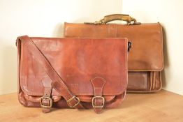 Two vintage leather satchels. A Hidesign leather satchel with a small handle, single buckle closure,