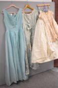 Four pieces of antique and vintage formal dress. A Robert Dorland Model evening dress, in light