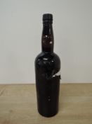 A bottle, believed to be Port, no label, no capacity to bottle, cork top