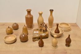 A selection of modern treen/turned wooden items, vases, bowls, fruit, all made by Denis Hunt of