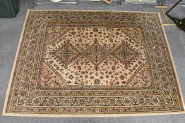 A modern Belgian machine made wool rug, of Europeanised Persian design, 227cm x 169cm