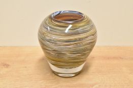 A heavy and decorative art glass vase, of tapering form and decorated with close packed swirls, most