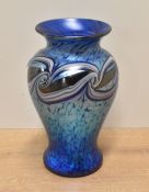 An attractive iridescent Okra Glass baluster vase, trail piece with mottled and swirled design by