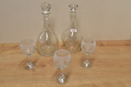 Three acid etched glass cat design wine glasses, a mallet form cut-glass decanter and a glass