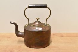 An early 20th century brass and copper kettle, of traditional design 29cm