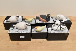 A group of seven Island Porcelain animal and bird studies, comprising Seal pup, Smew, two Ptarmigan,
