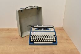 A vintage Imperial Tab-O-Matic typewriter in blue