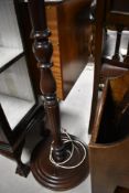 A traditional mahogany standard lamp