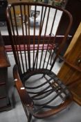 A dark stained Ercol Windsor style easy chair (no cushions)
